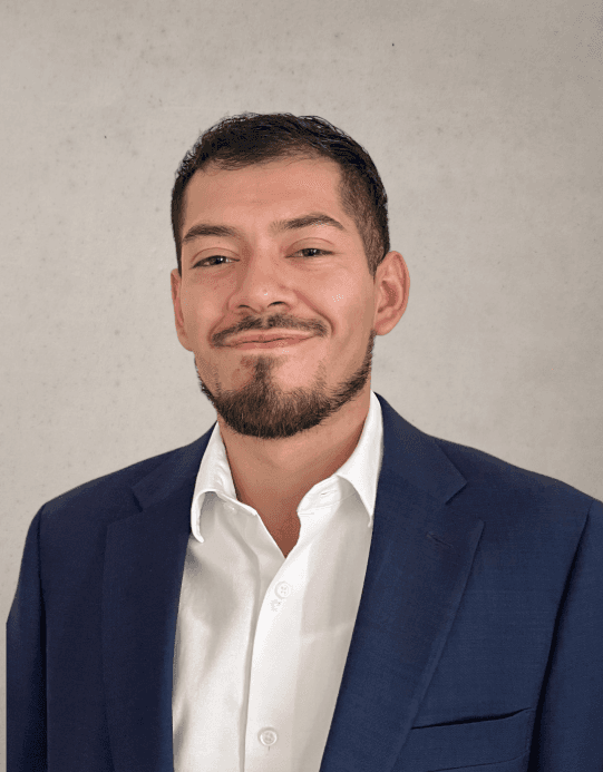 gold and black bottle on white wooden table