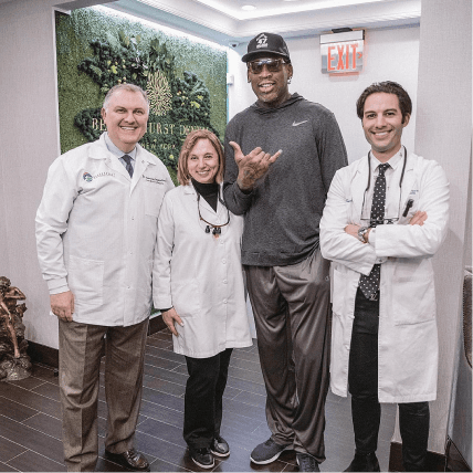 Bensonhurst Dental Care - Dr. Marina Rubinshtein, Dr. Alex Rubinshtein, and Dr. Daniel Rubinshtein with Dennis Rodman