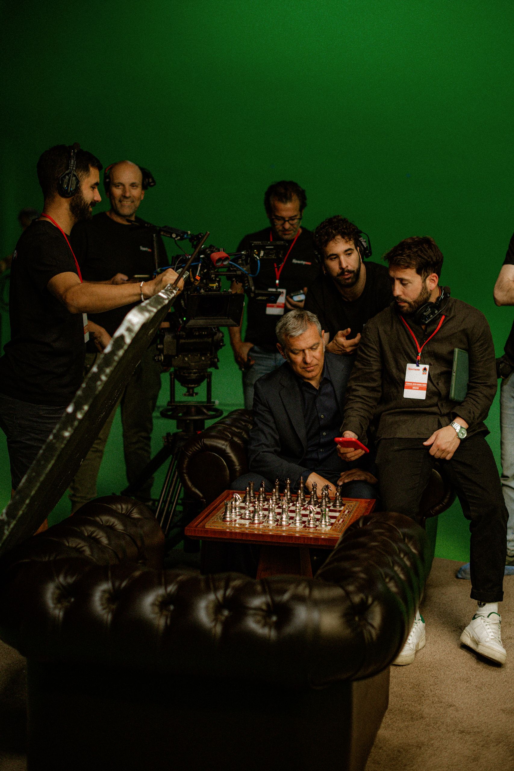 José Mourinho at a chessboard surrounded by the crew during the Sportybet Atreva-se shoot