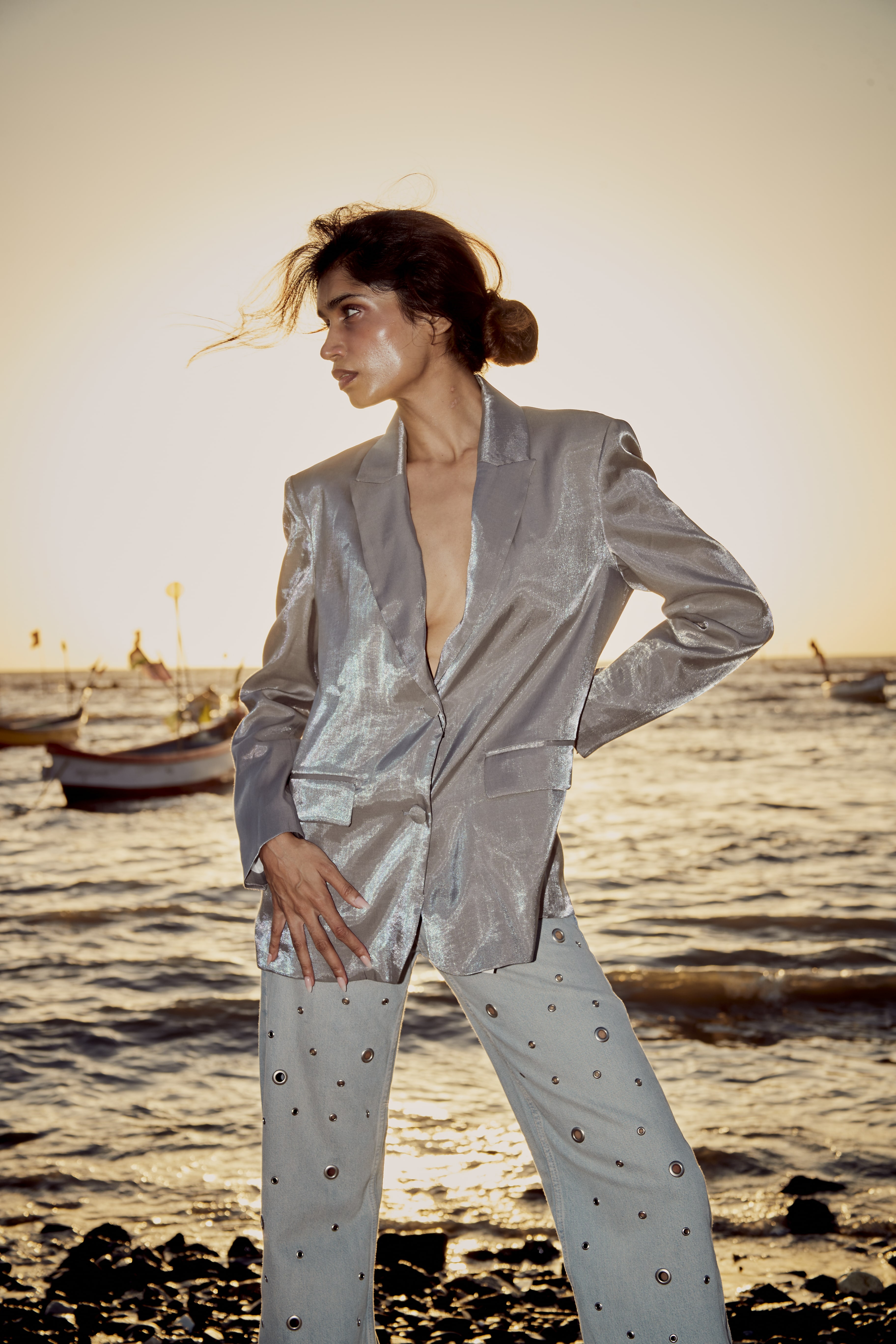Group of friends smiling on a lively city street at night