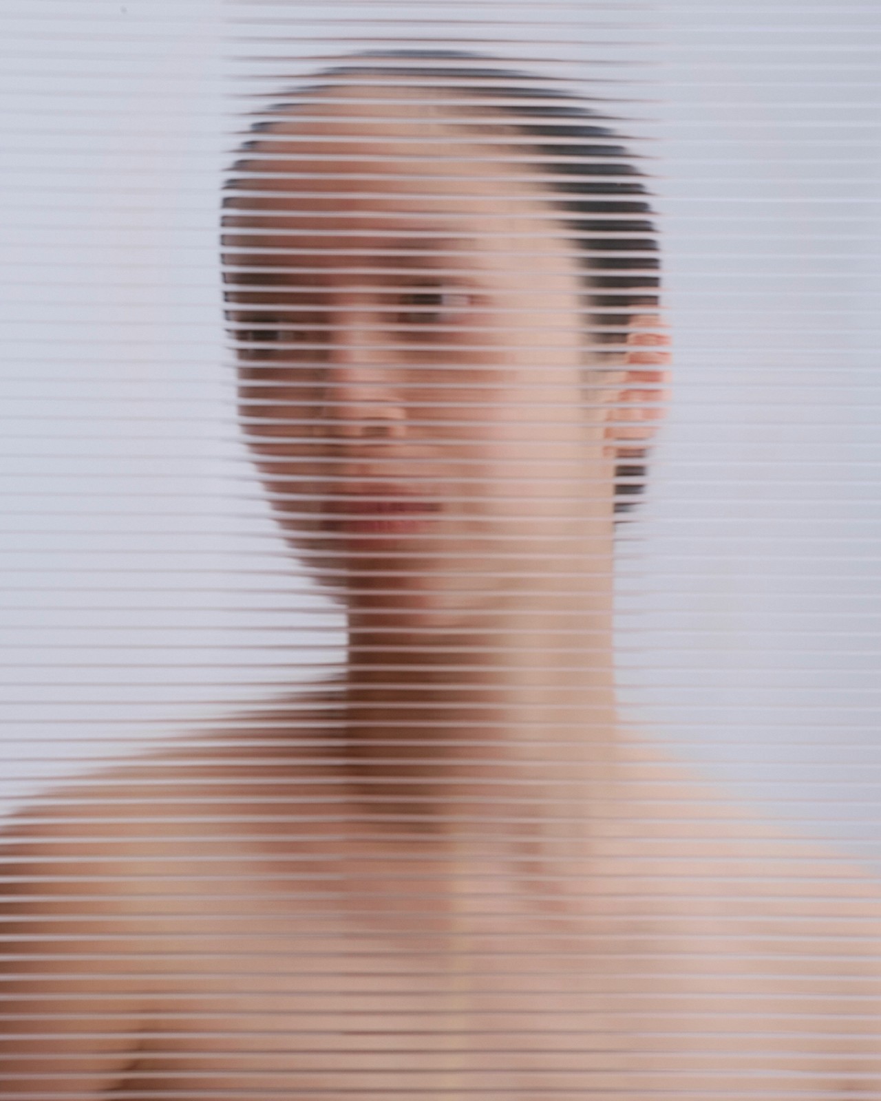 Soft, abstract portrait of a woman in profile, rendered with horizontal light lines.