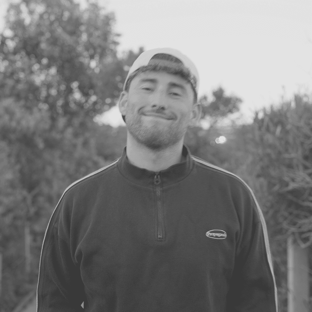 a black and white photo of a woman in a dress