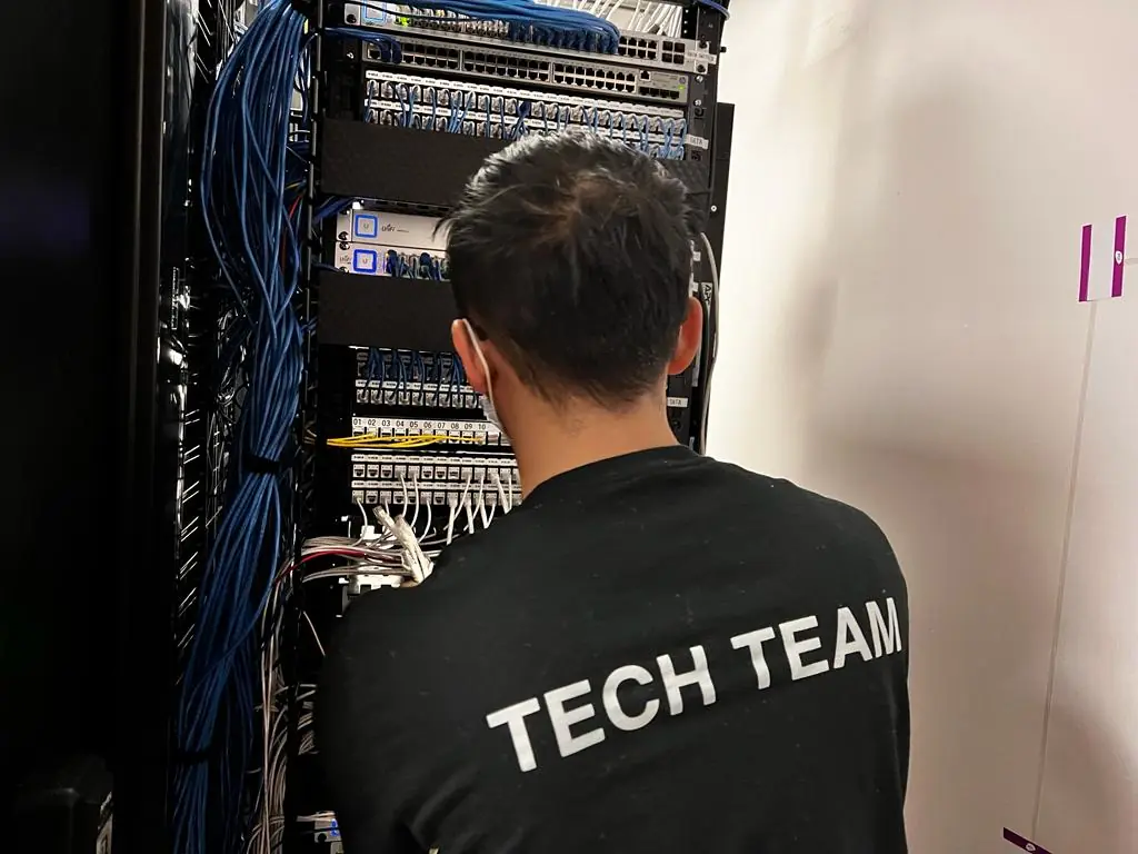 Structured cabling and network rack setup during data center relocation and infrastructure migration.
