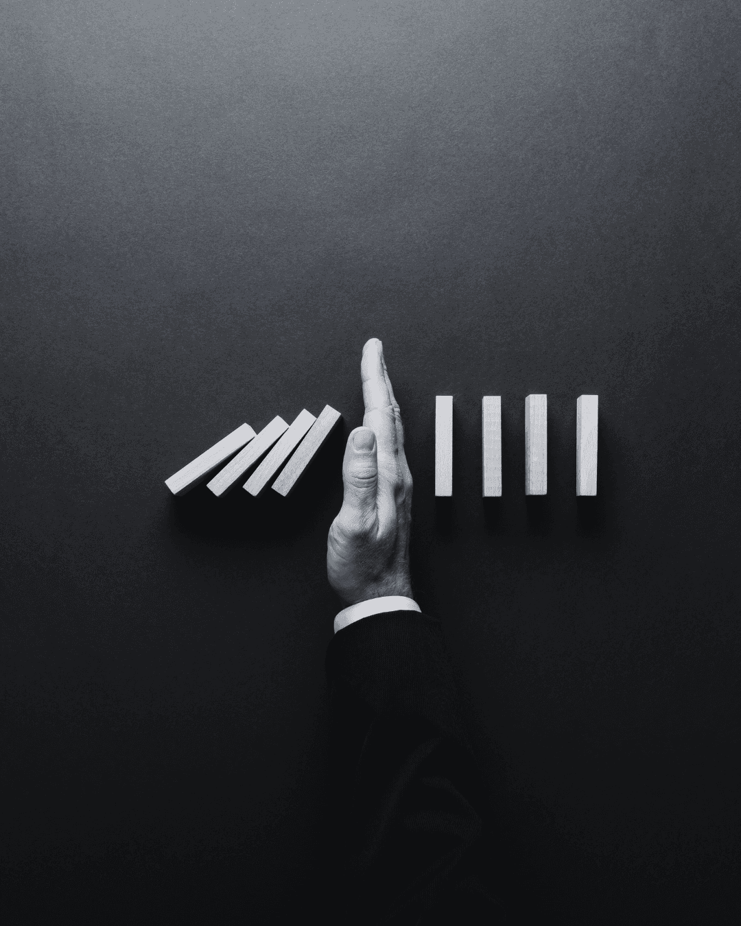 Person in brown jacket reading or writing in a book