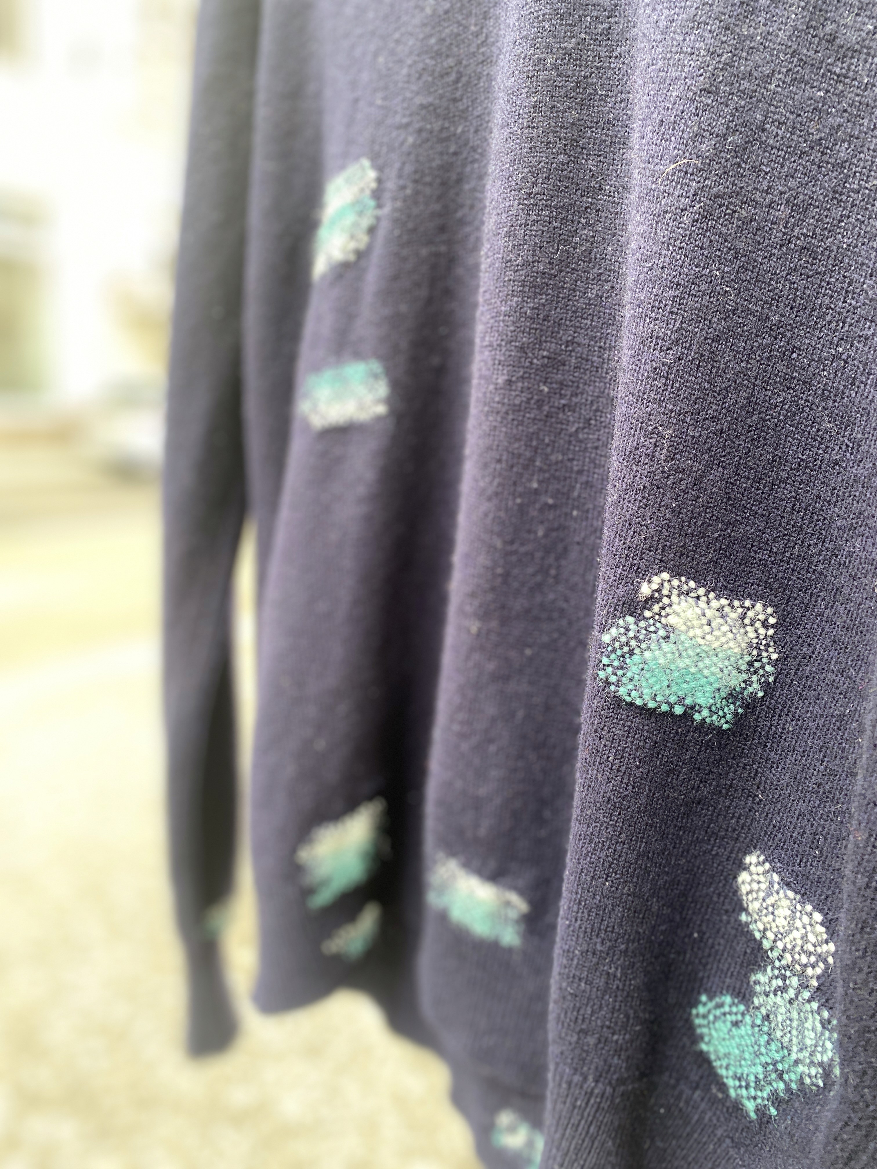 mended jumper close up