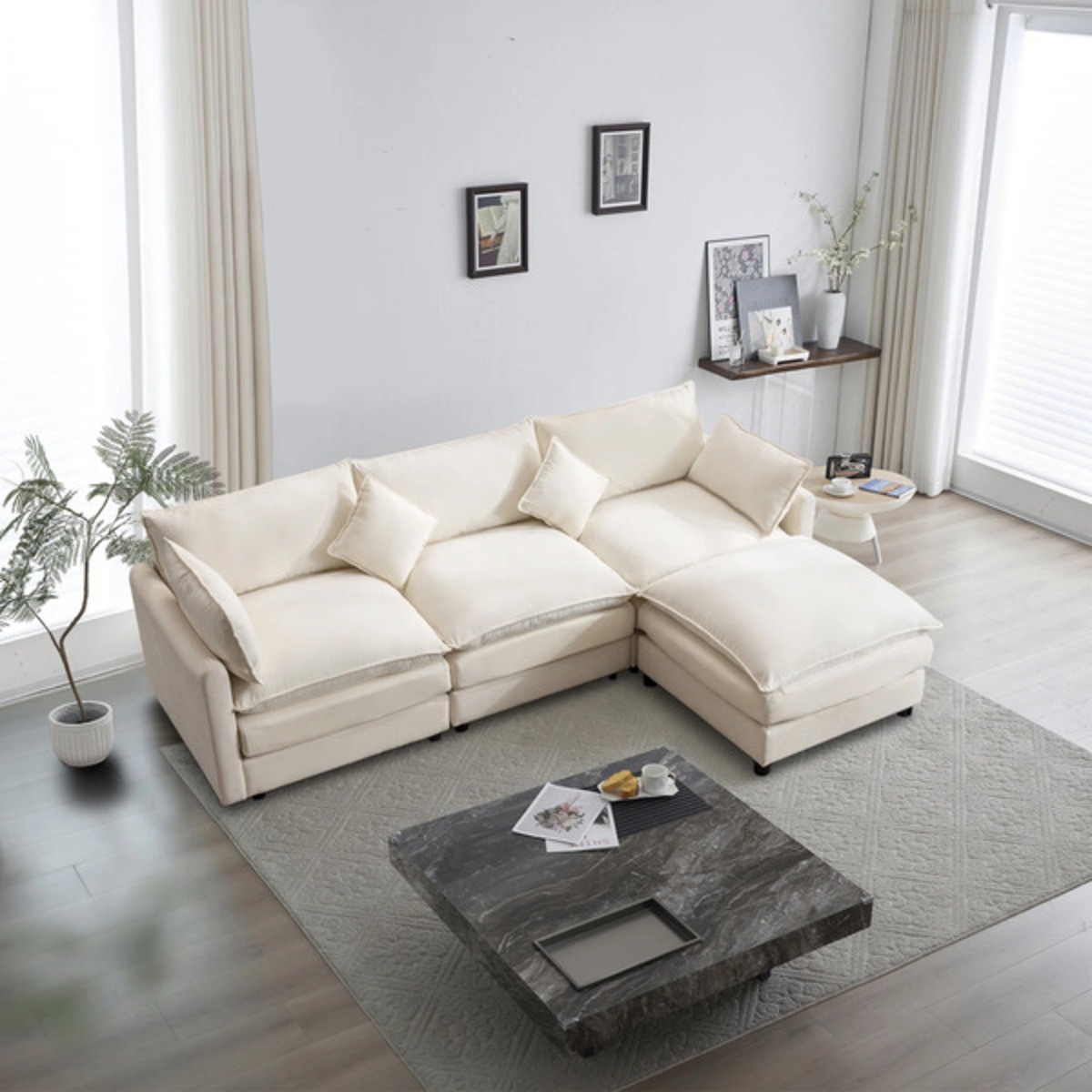 Muumbus L-Shaped Modular Cloud Sofa in a bright living room with a gray rug, marble coffee table, and minimalist decor