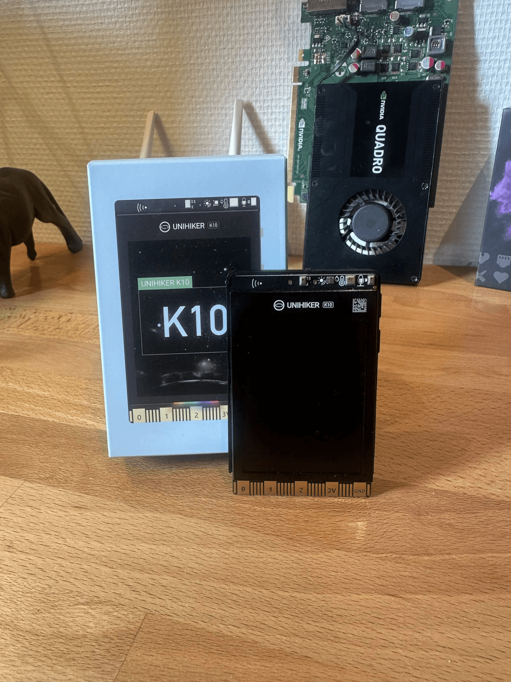 UNIHIKER K10 in a custom 3D-printed case as part of a modern desk setup.