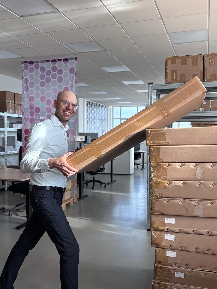 man stacking a box, ready for shipment