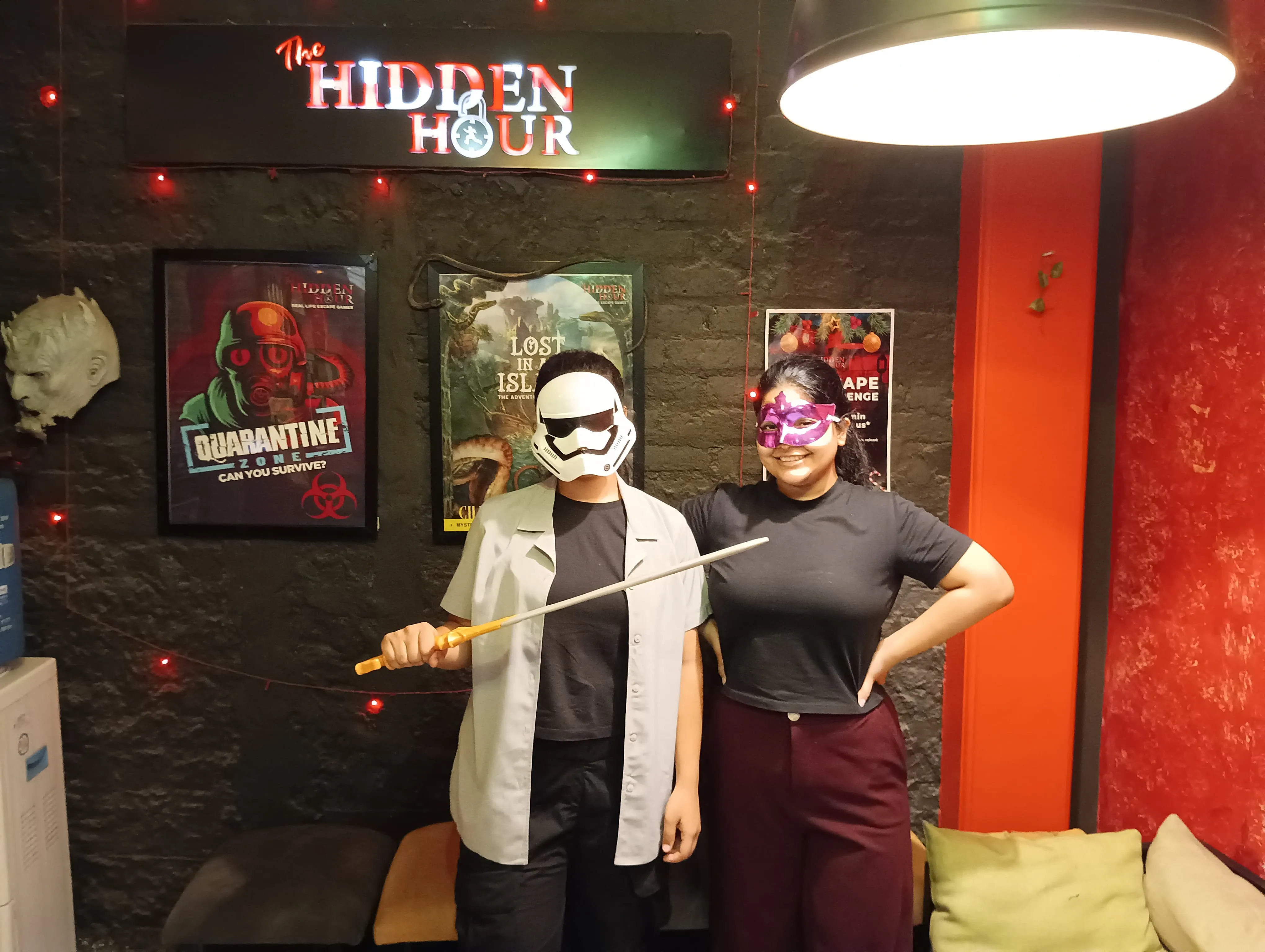 Birthday girl cutting cake during an escape room celebration event