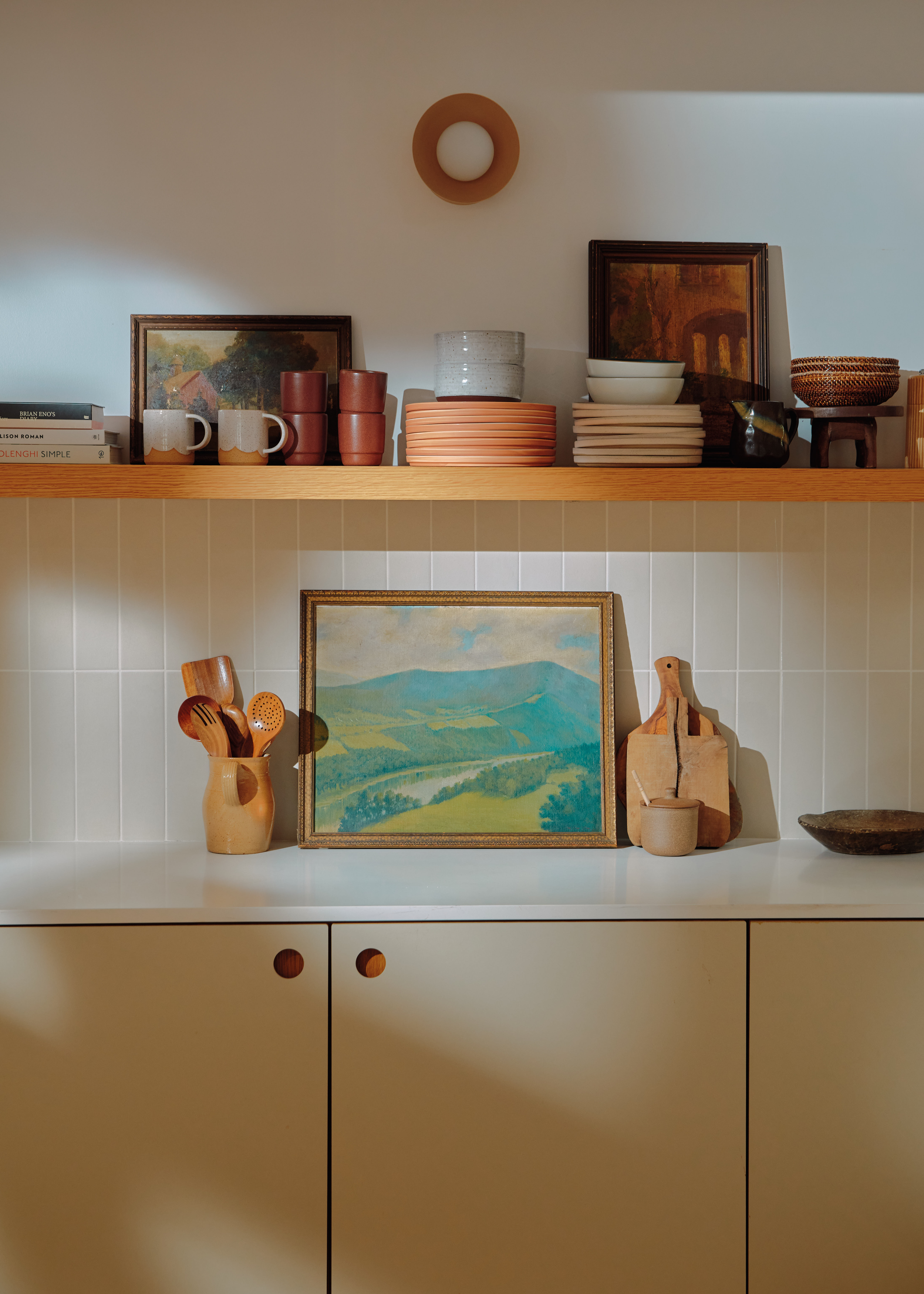 Young woman in casual clothing posing against a white background.