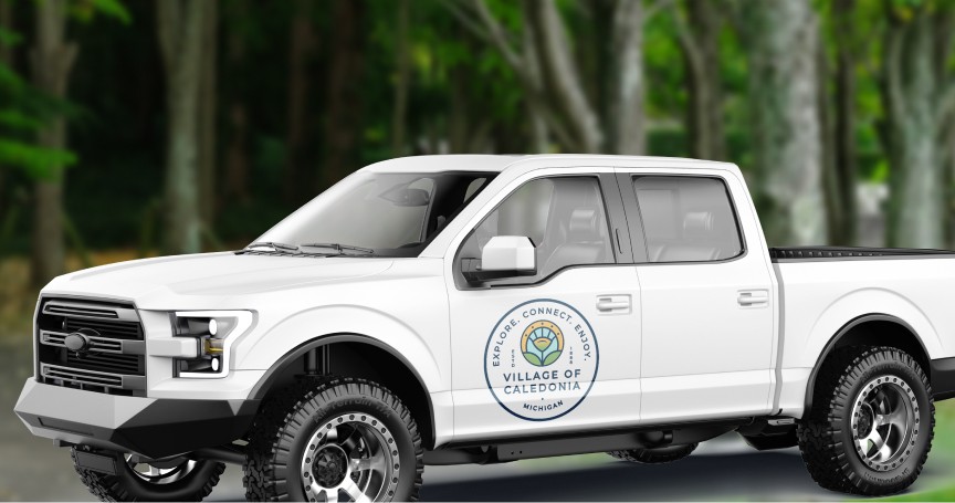 ar of Just Livity Sea Moss Purple Gel on a kitchen counter beside a wooden bowl of fresh strawberries and blueberries.