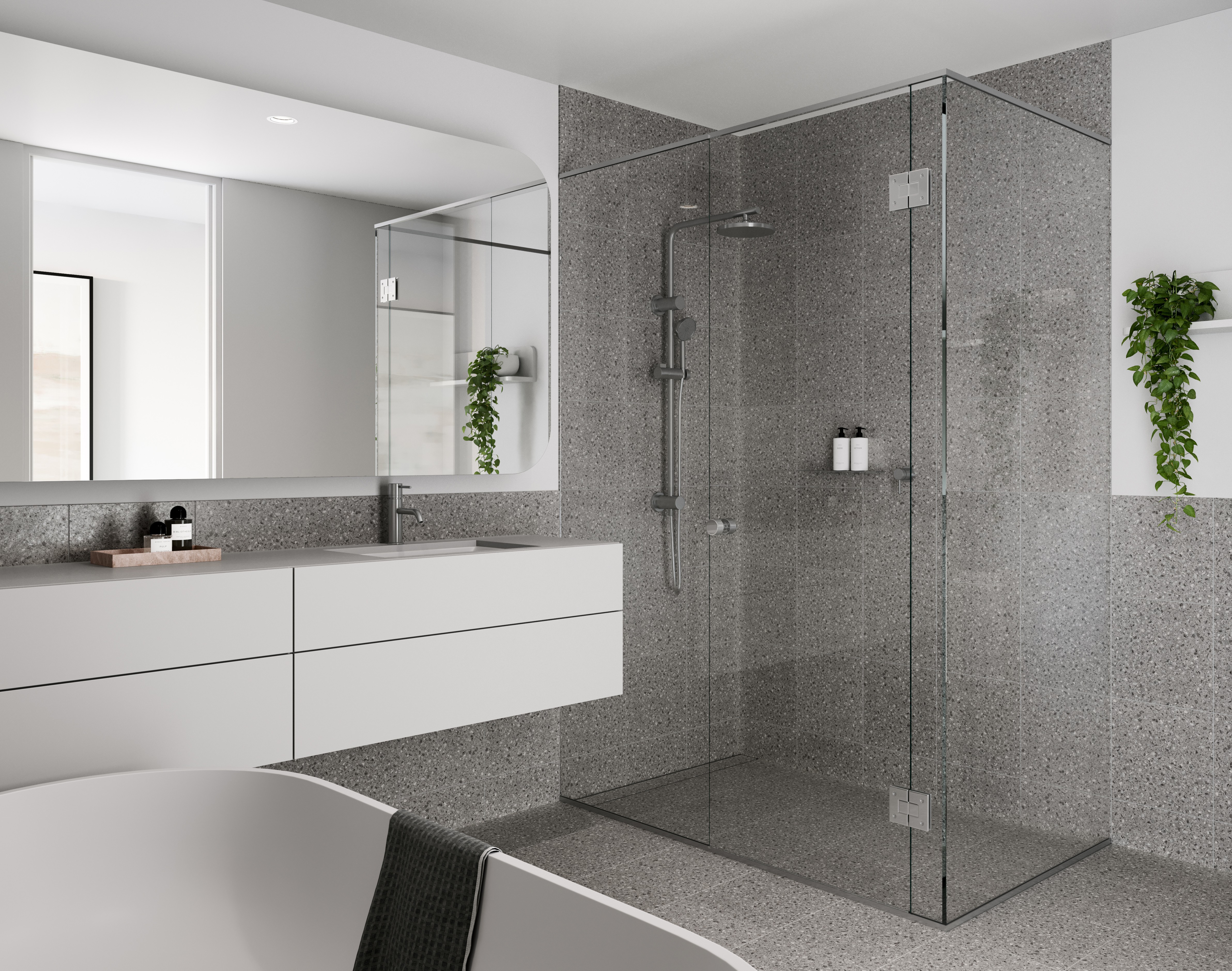 Elegant ensuite bathroom at The Charlotte Woden with terrazzo walls, glass shower and modern cabinetry, part of off the plan Canberra apartments secure with Coposit.