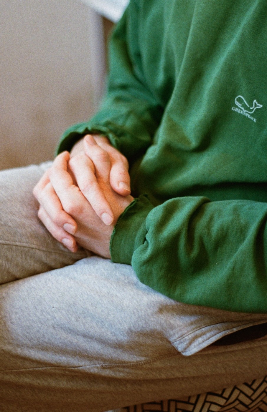 Intertwined hands with soft analog film grain texture