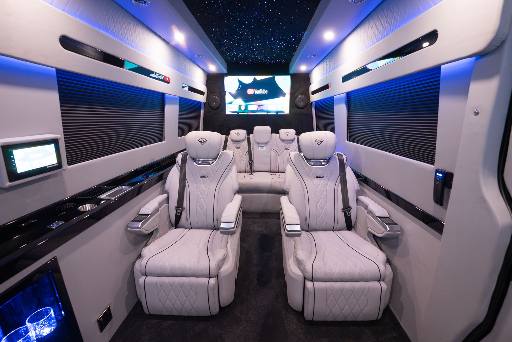 Two happy men driving a sportscar with a joyful expression, ideal for car rental adventure promotions.