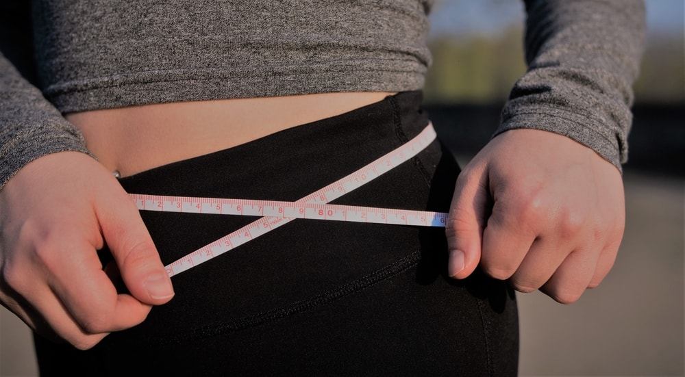 flat belly with mesuring tape