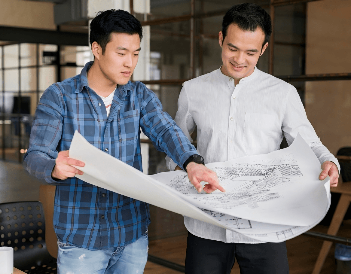 專業團隊審閱機場展覽設計與 Pop-up Store 技術圖則,處理機場禁區工程與審批文件 (Professional team reviewing airport exhibition design and pop-up store technical drawings for restricted-area approval)