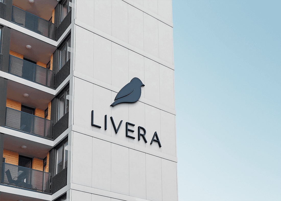 Graphic design mockup of an apartment building for Livera — modern, clean brandmark style logo of a bluebird with an sleek sans serif typography, designed by Will Lefkovich.
