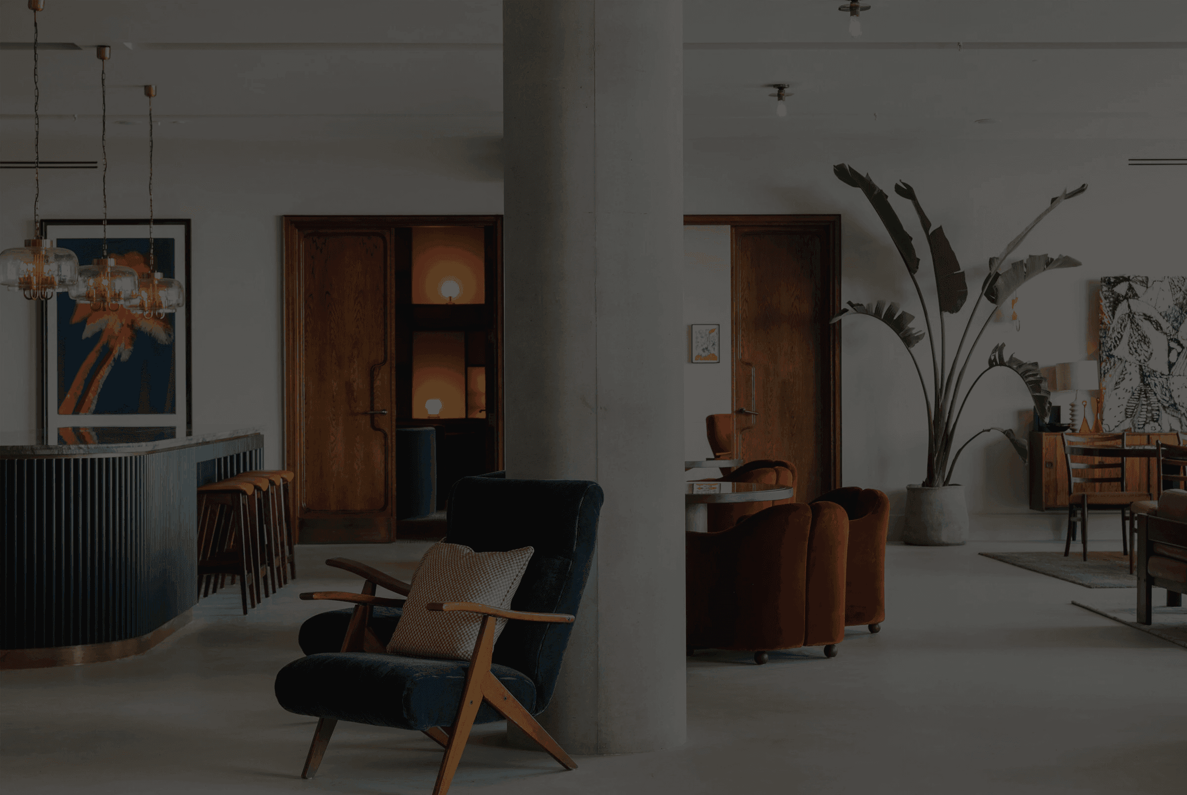 Blurry cityscape with red light and street lights at night.