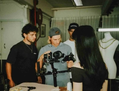 Reilin standing next to his film crew