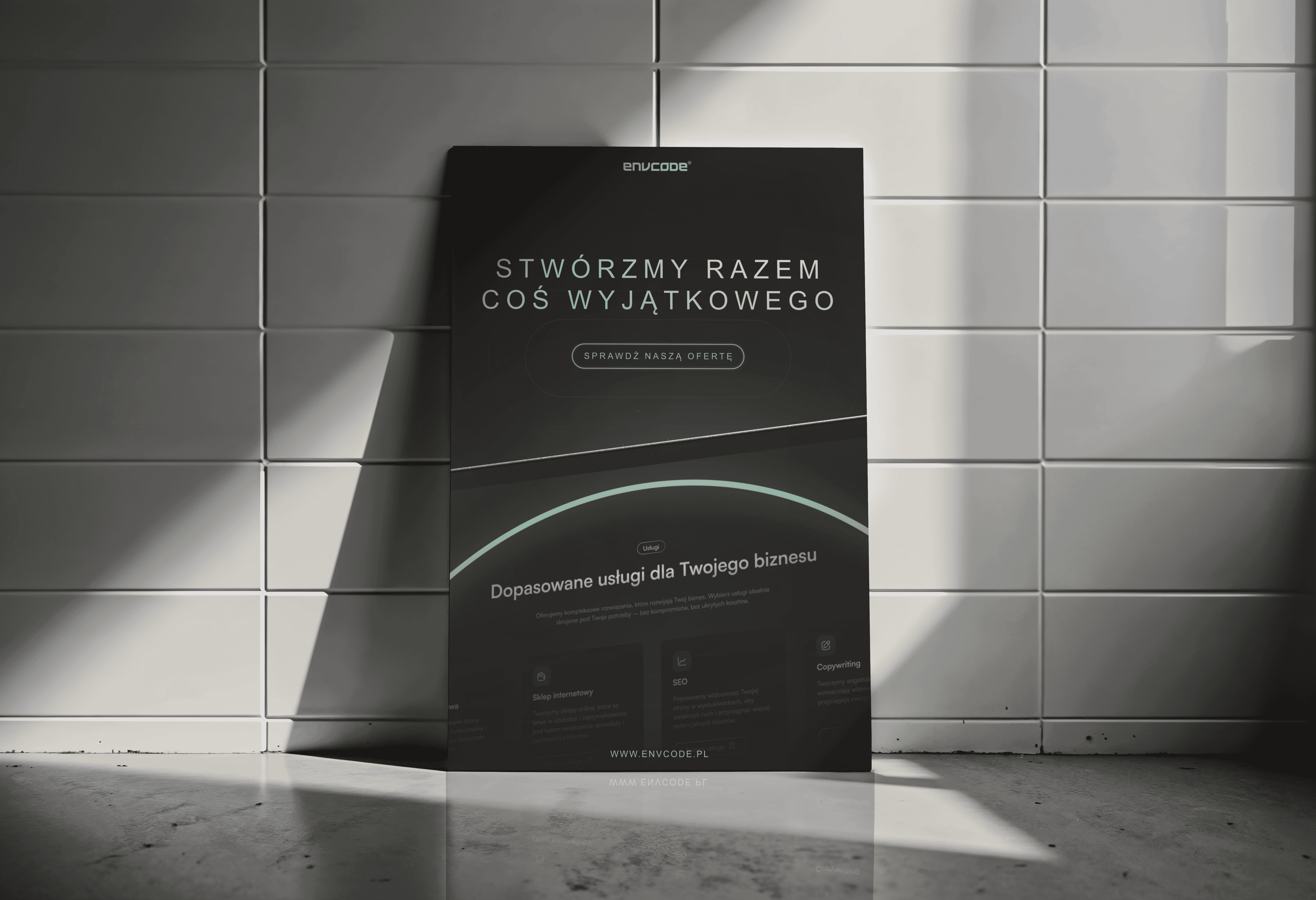 man wearing grey t-shirt standing in front of man sitting on chair