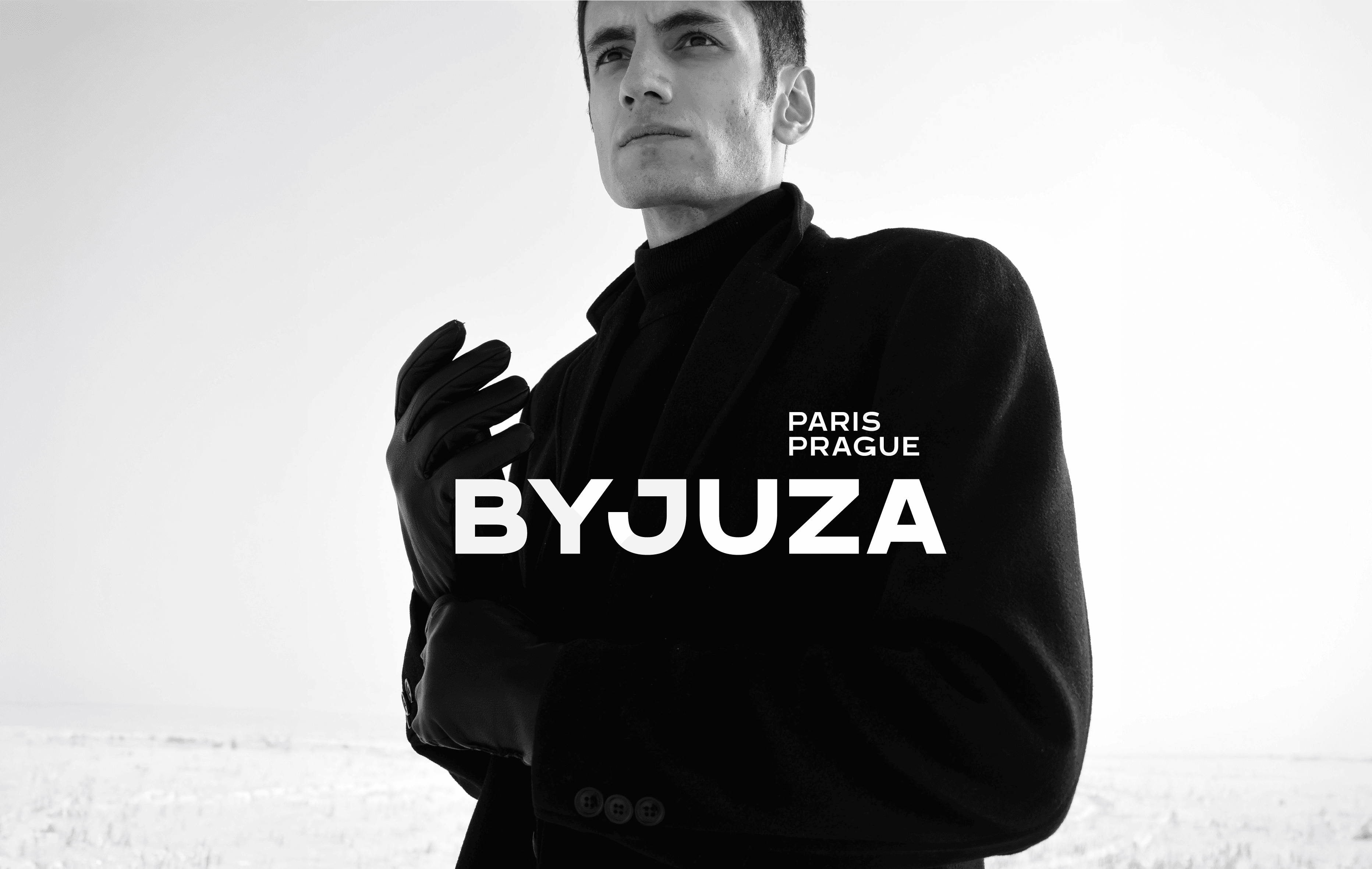 ByJuza menswear branding with minimal typography and a confident fashion aesthetic