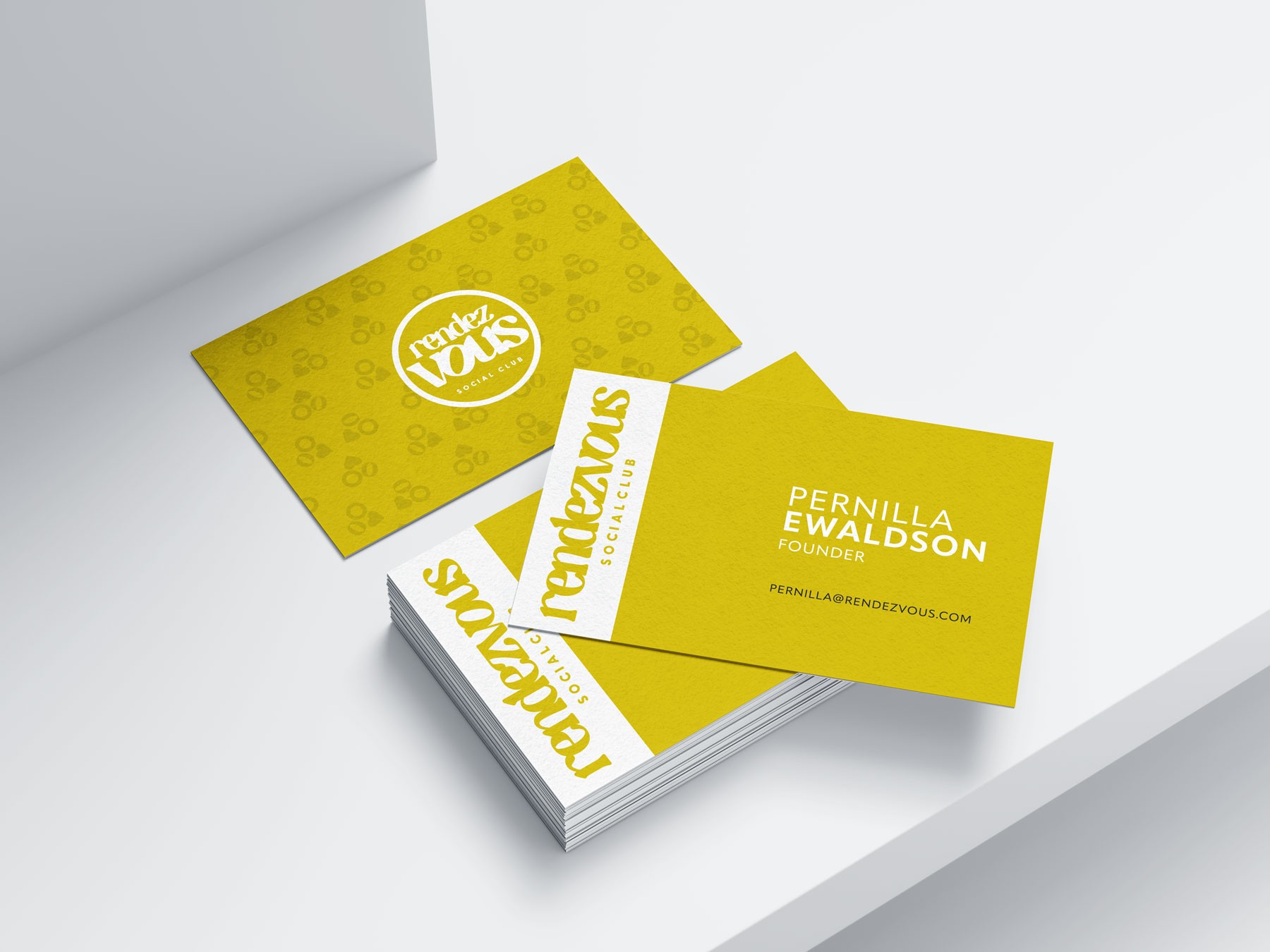 Business card of Rendezvous Social Club Mallorca in yellow and white