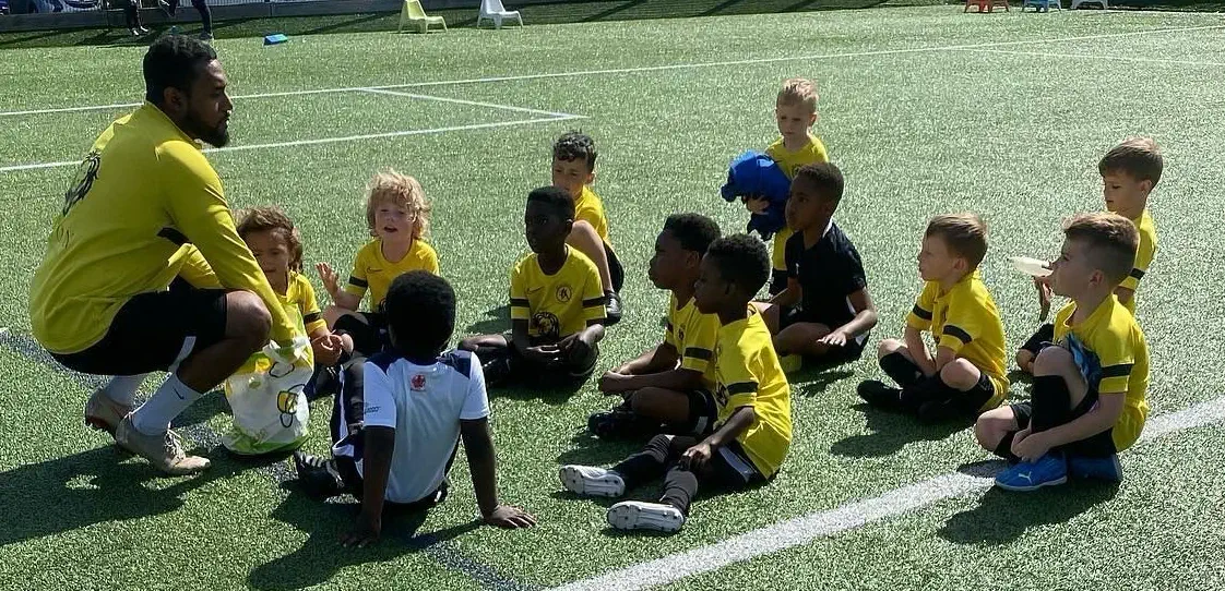 Kids sat around coach