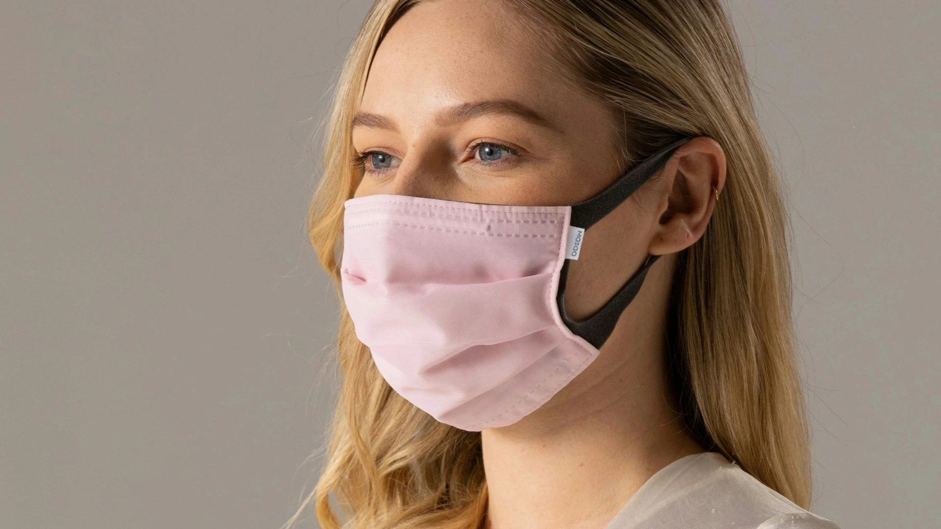 woman in white long sleeve shirt wearing white mask