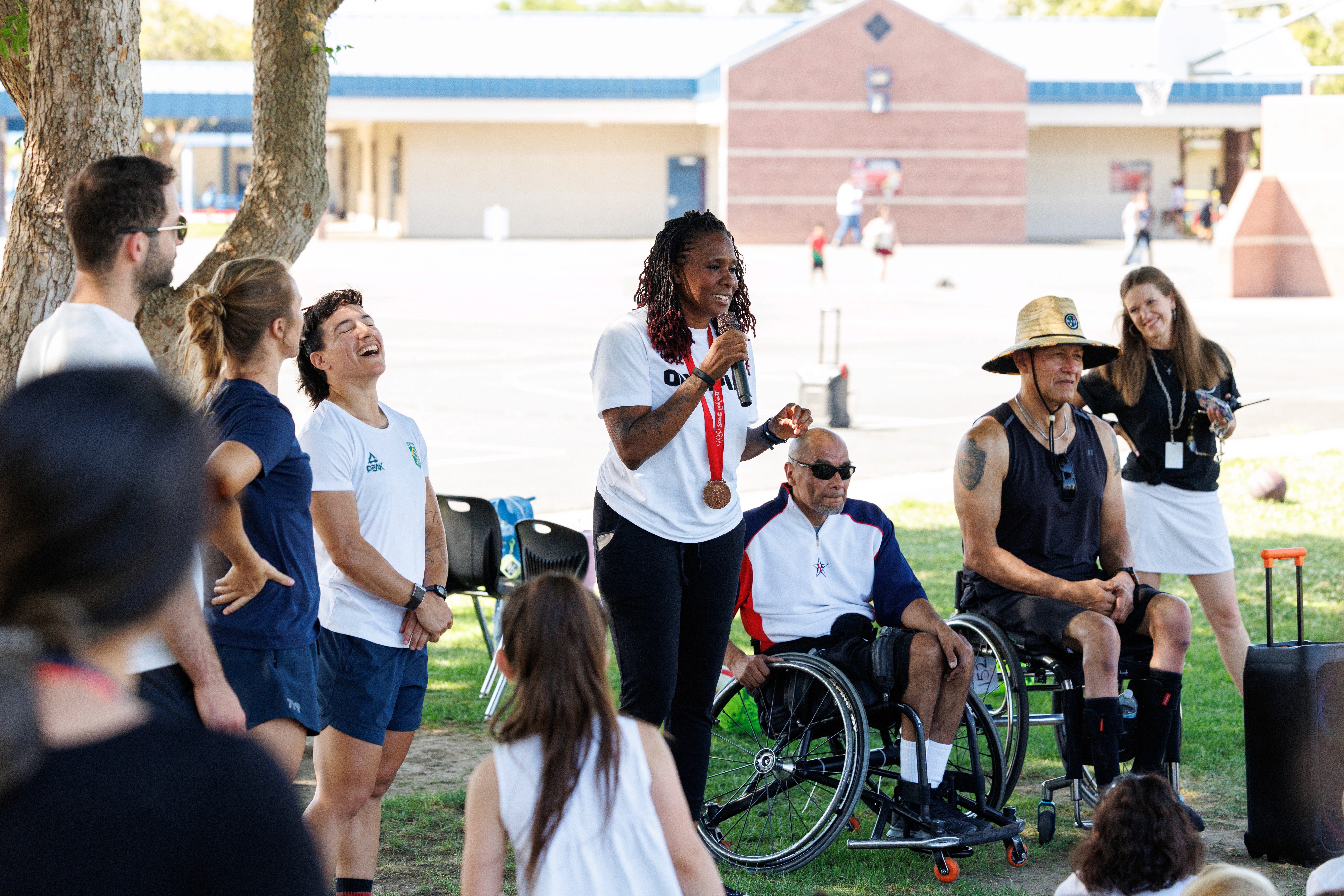 group of people playing soccer on green grass field during daytime