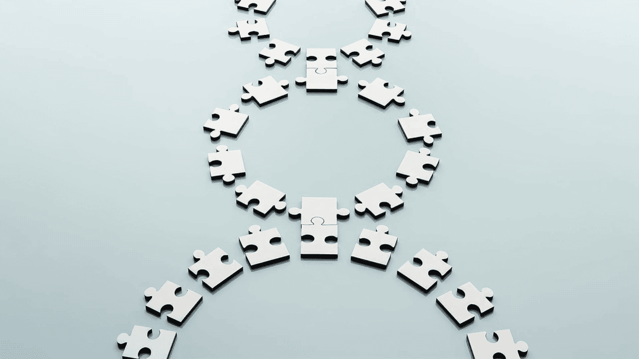 A series of interconnected puzzle pieces forming circular patterns on a light background, symbolizing collaboration, connection, or problem-solving.