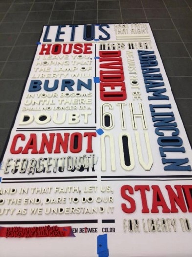 vertical banner with blue, red and blue text on it
