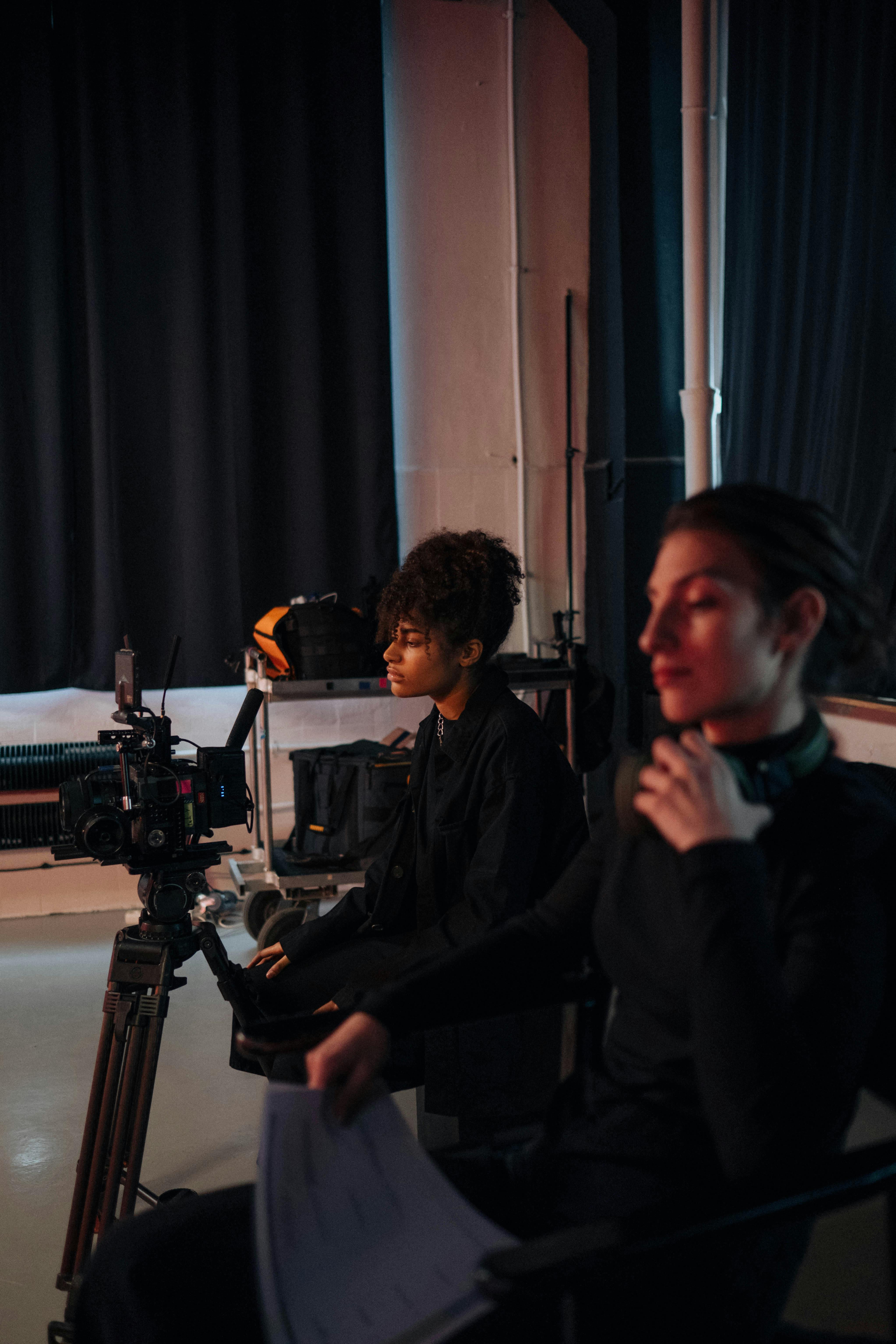 Film crew filming studio with cameras.
