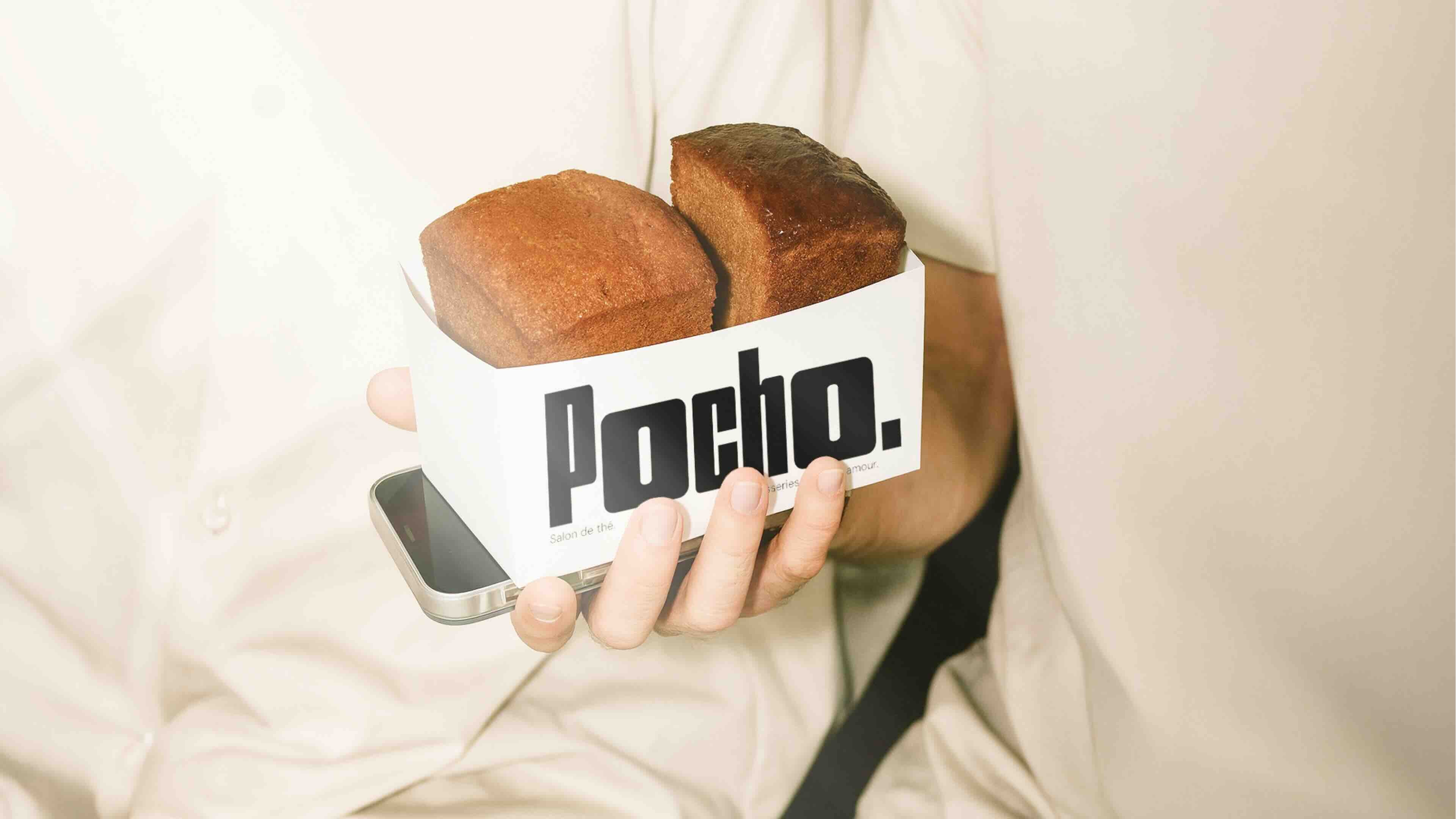 Beige golf cart parked on a green course with a canvas tote bag hanging on the side, decorated with green stripes and a logo.