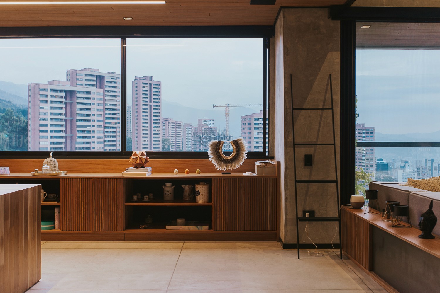 Double-height interior with flowing sculptural forms and warm raking light