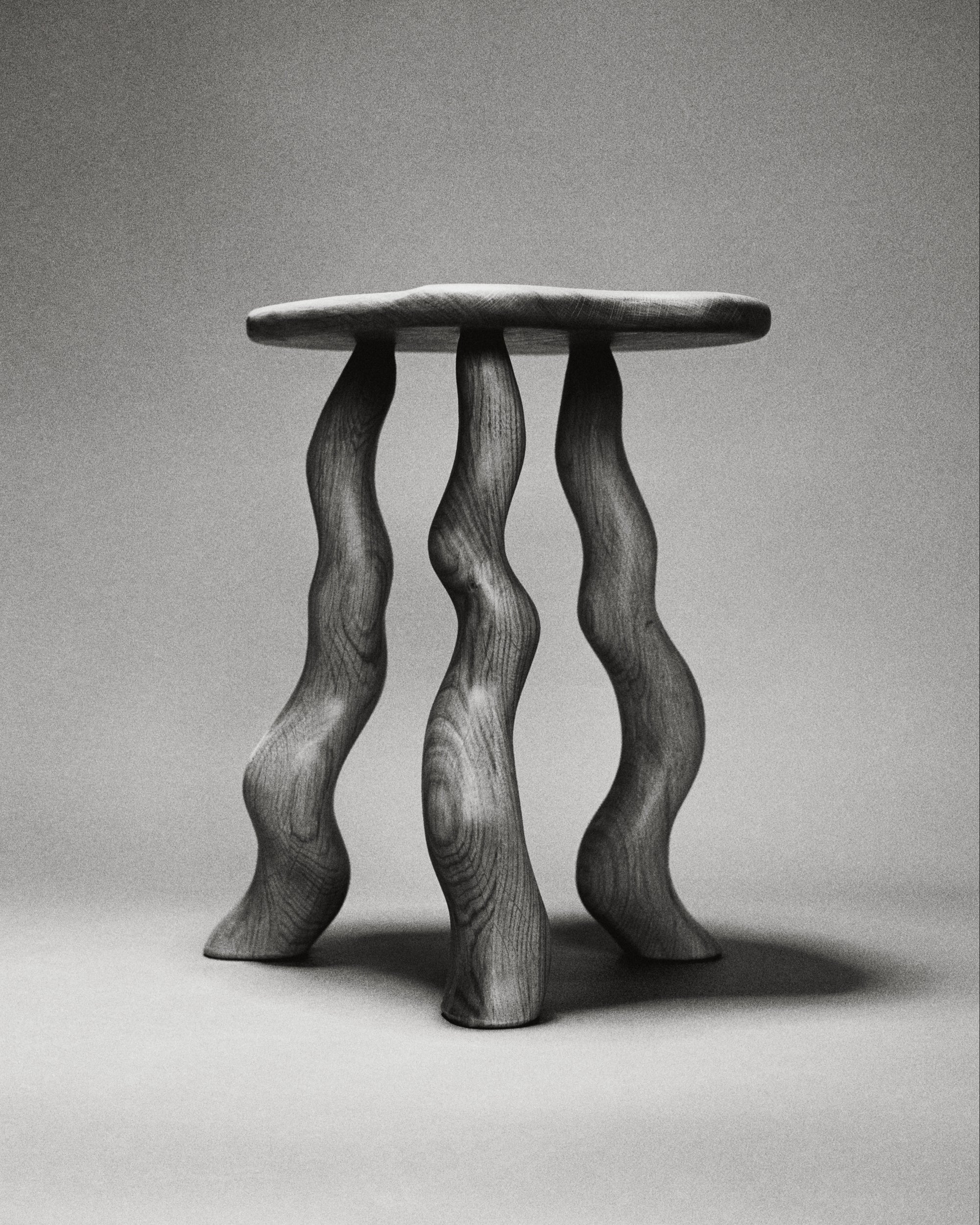 Oak Dancing Stool with carved wavy legs by Wilkinson & Rivera.