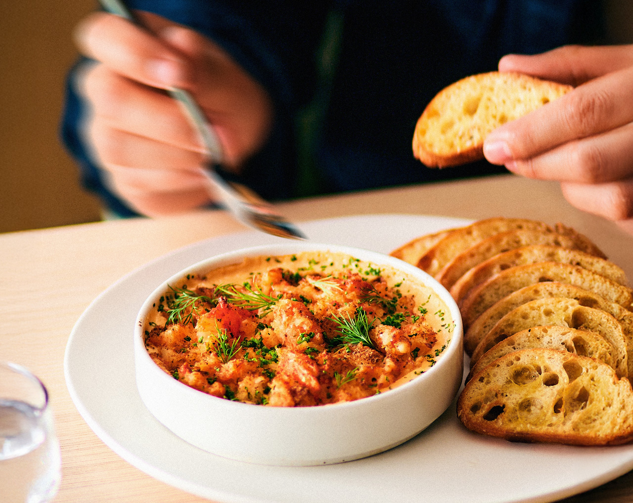 a man enjoying crab dip