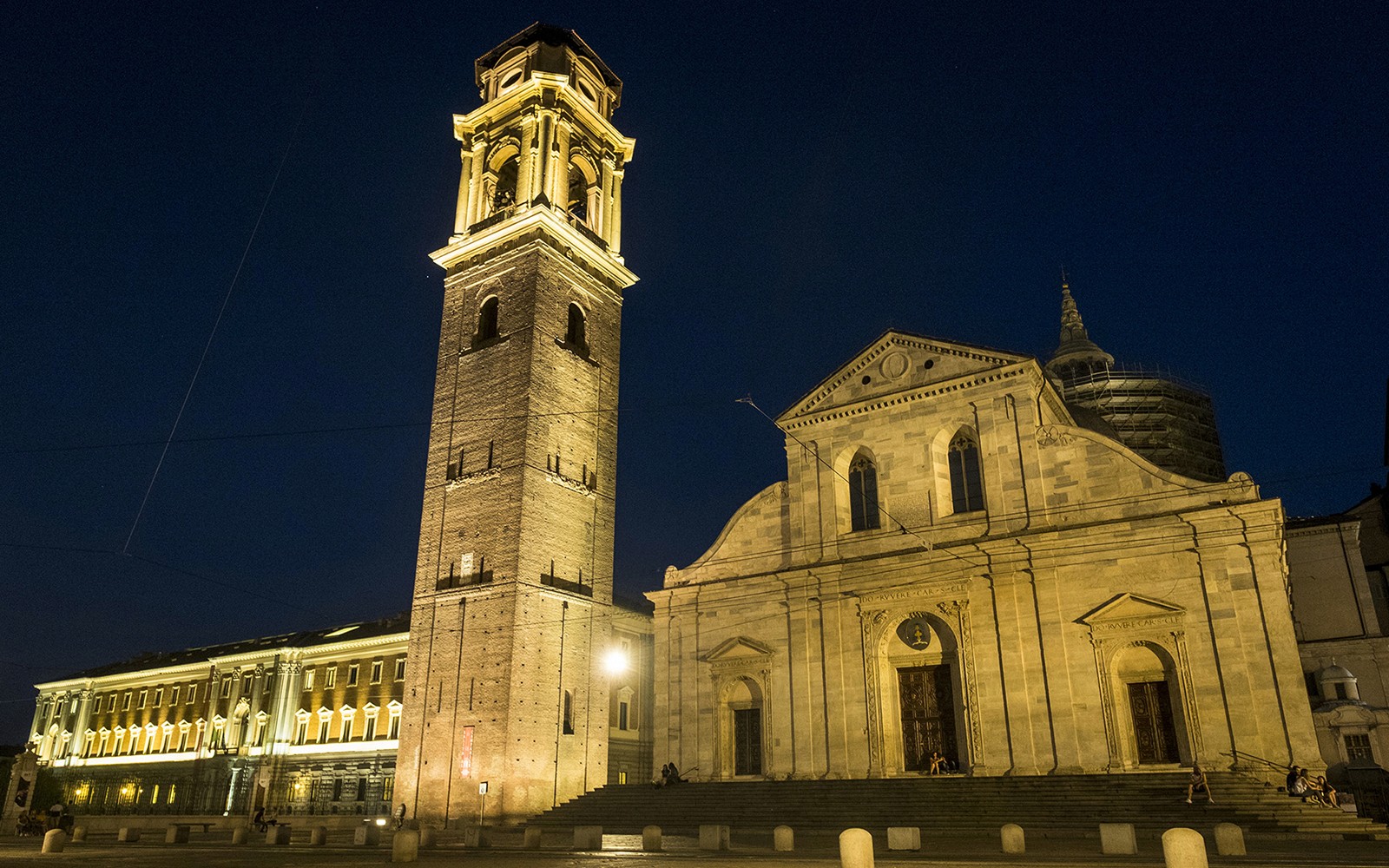 Torino Cathedral and bell tower illuminated at night during Italian Guided Tour.
