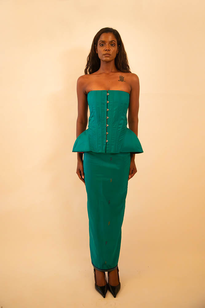 Kamal is a one-of-a-kind bell corset and skirt, handcrafted by skilled artisans in-house using a vintage emerald green silk saree.