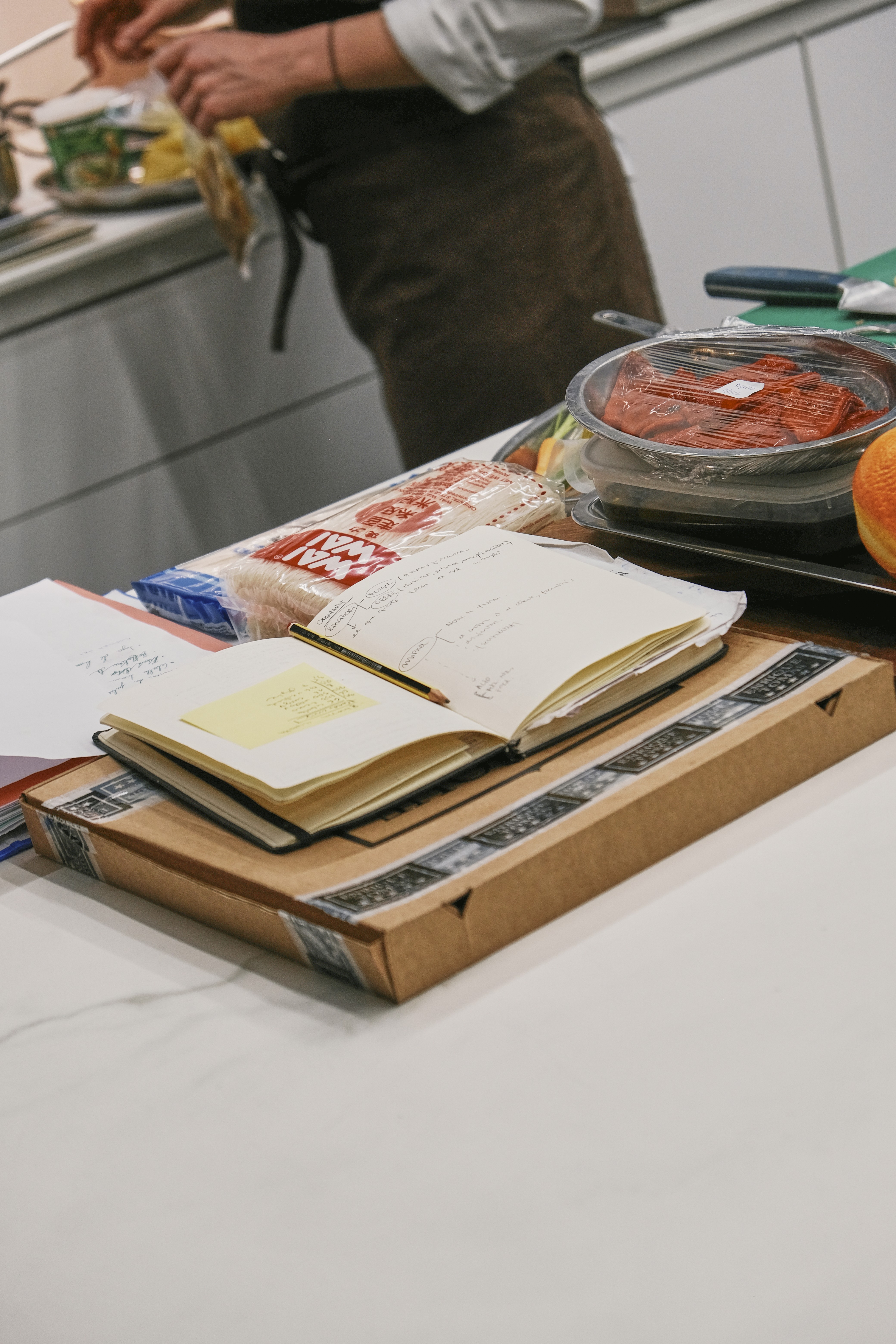 Person in a white off-shoulder top using a MacBook laptop, with text overlay 'What's new in digital?' and the fabrica® logo in the top corner.