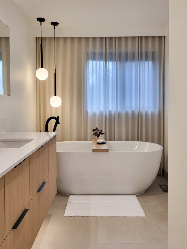 Image of Luxurious primary ensuites with freestanding tub and modern design elements by KHD Homes design-build construction.