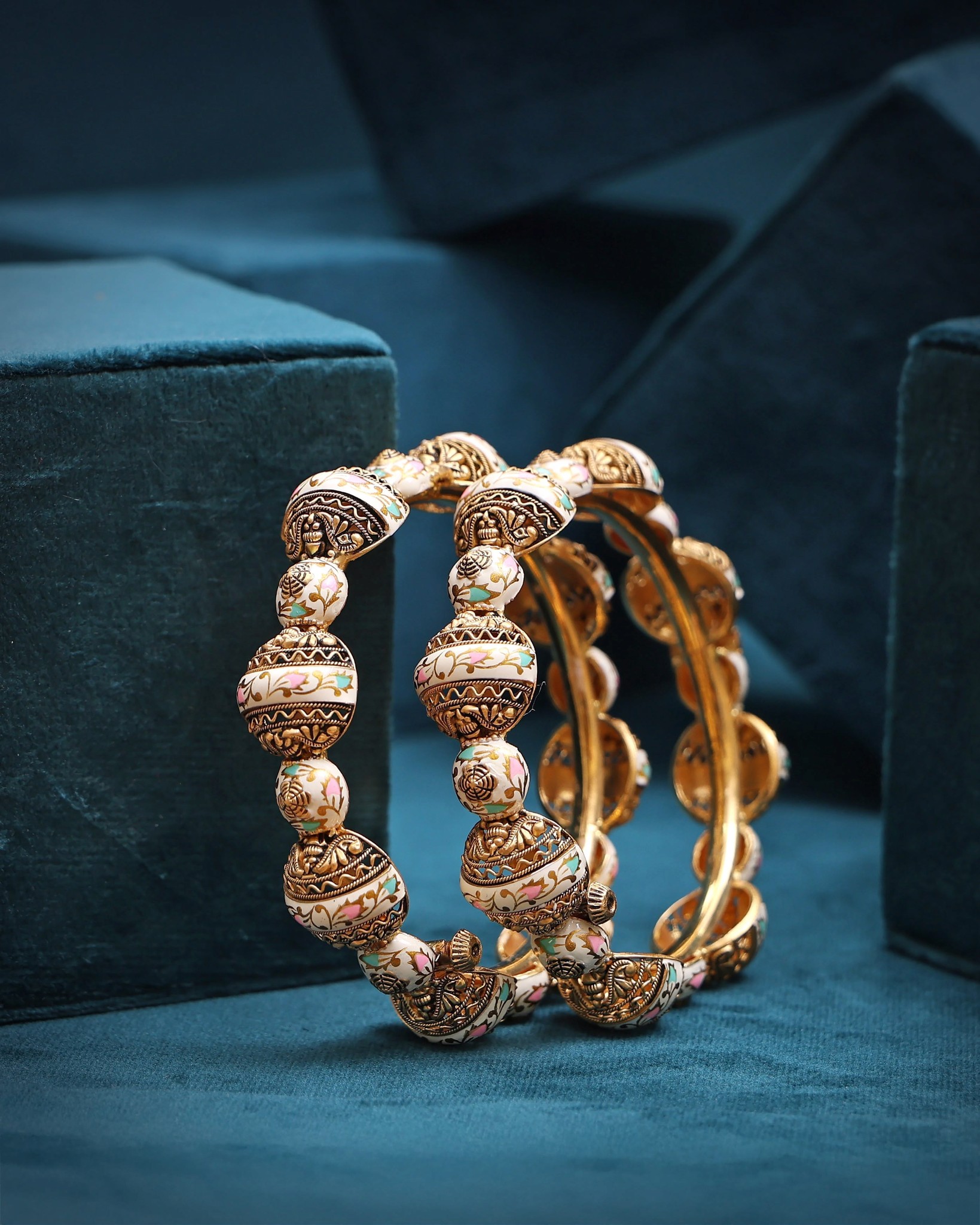 Traditional gold enamel bangles with intricate beadwork by JORA Jewellers.