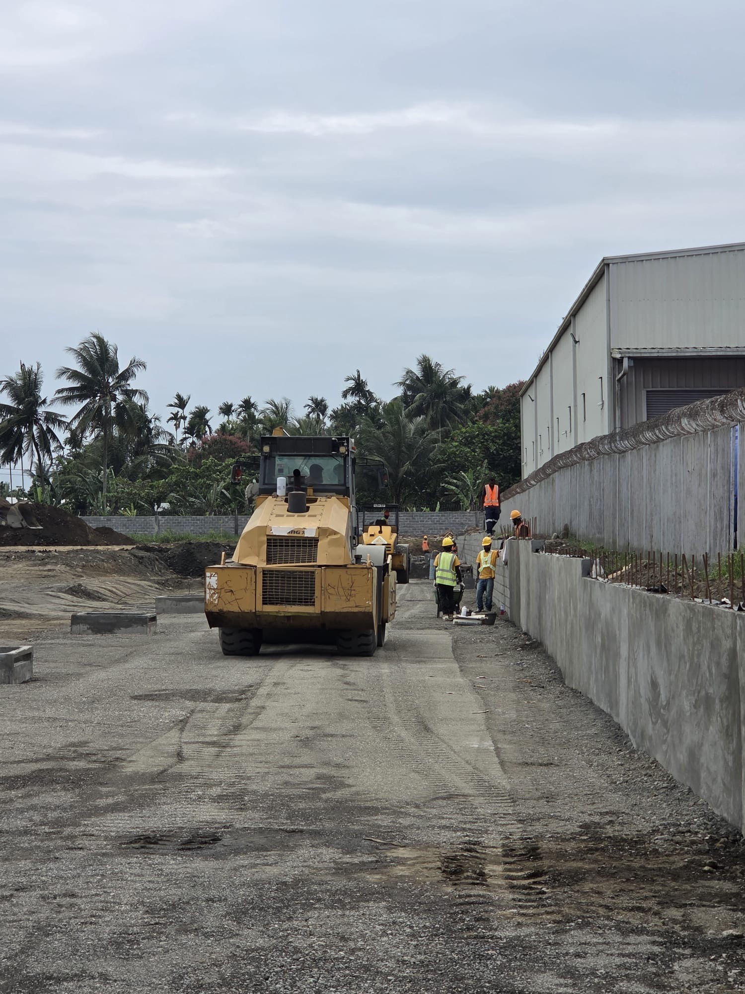 Komatsu PC300 excavator and support plant in the contractor laydown yard