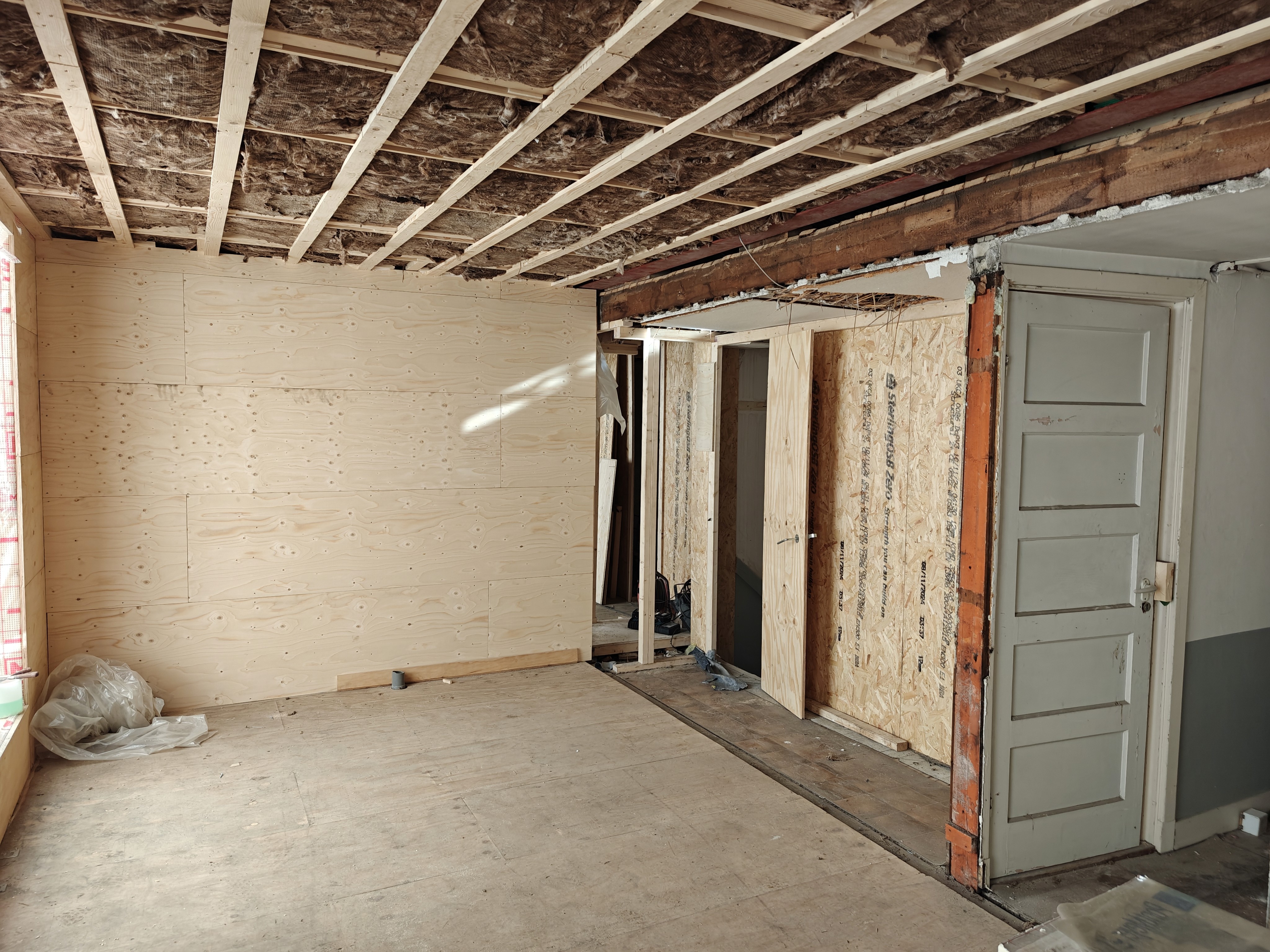 white wooden shelf near white wall