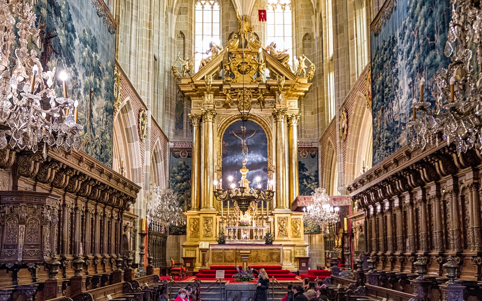 Wawel Cathedral interior with ornate altar and chandeliers, Krakow guided tour.