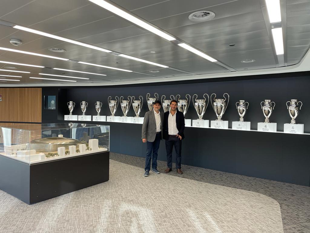 Woman in real madrid jersey and ripped jeans