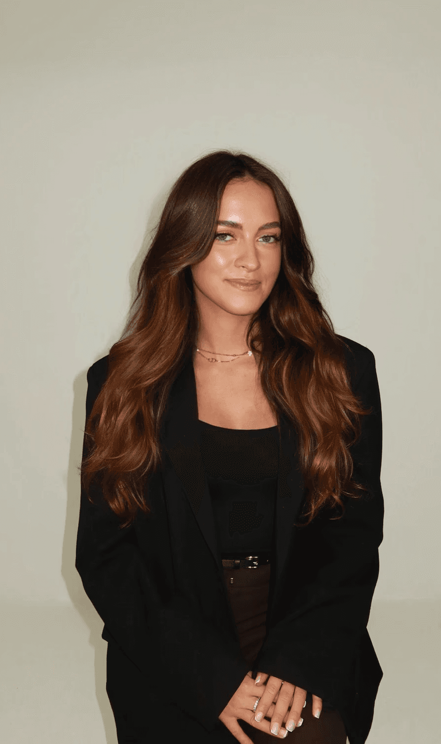 a blurry photo of a person standing in front of a wall