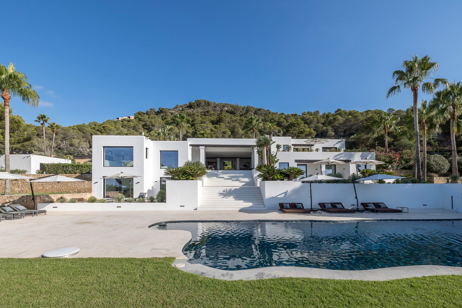 Daytime front view of the exclusive luxury villa in Ibiza, a private VIP estate property holiday retreat for weddings and events.