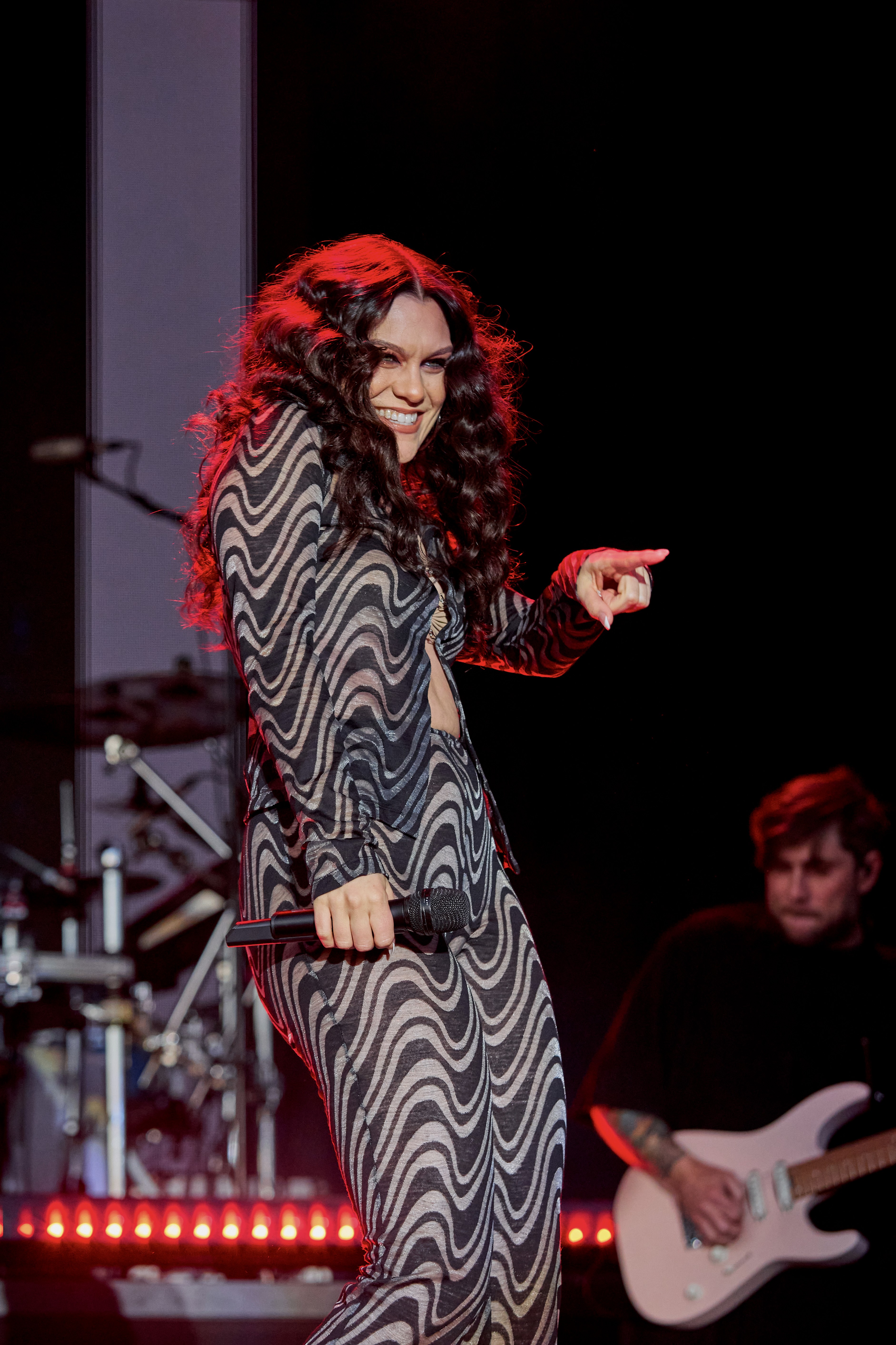 Singer Jessie J at Liv golf event London performing on stage - event photographer Paul Severn