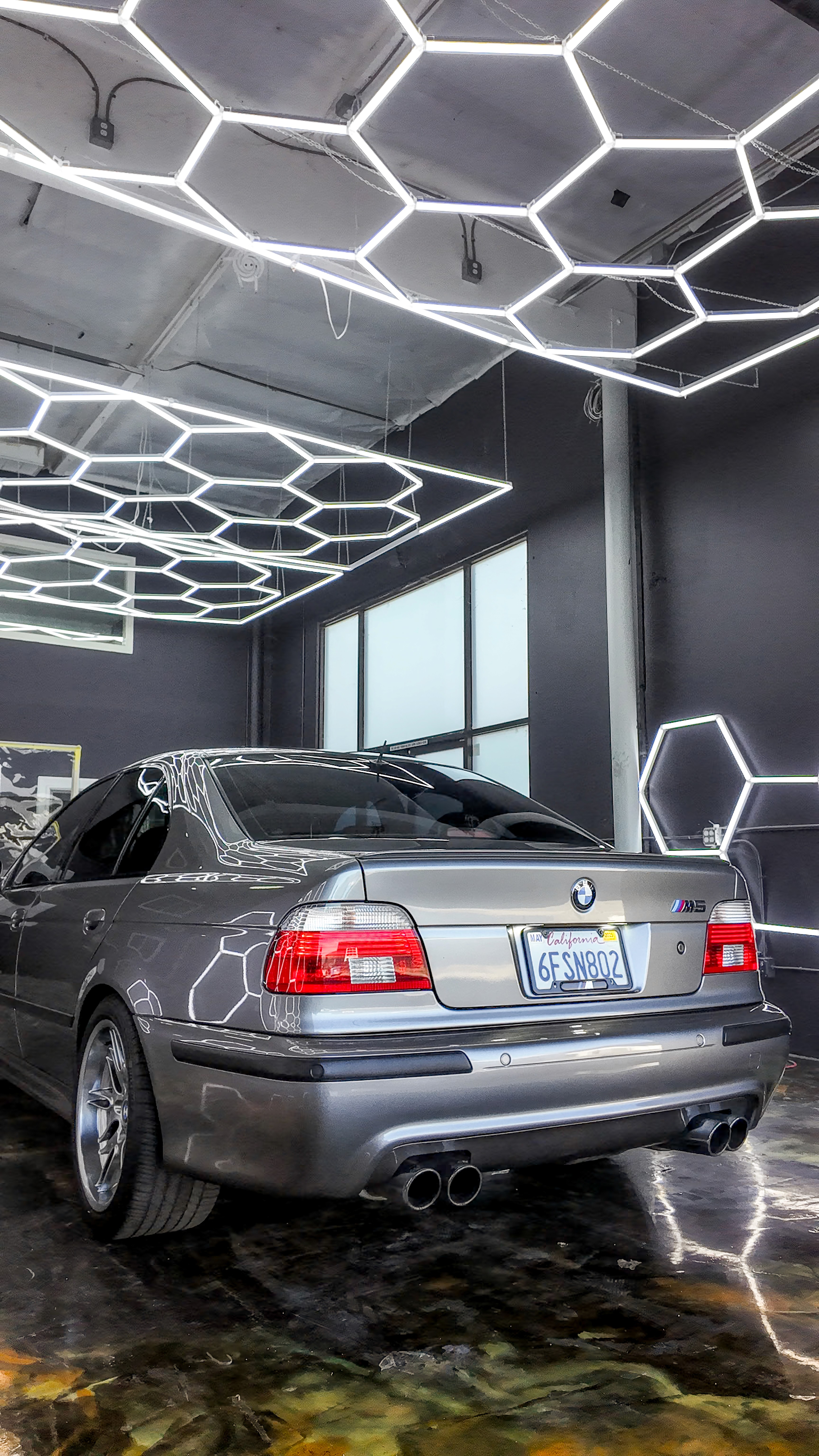 Gray 2002 BMW E39 M5 with Icon Rocklear paint protection, rear three quarter view, Dragon Auto Milpitas