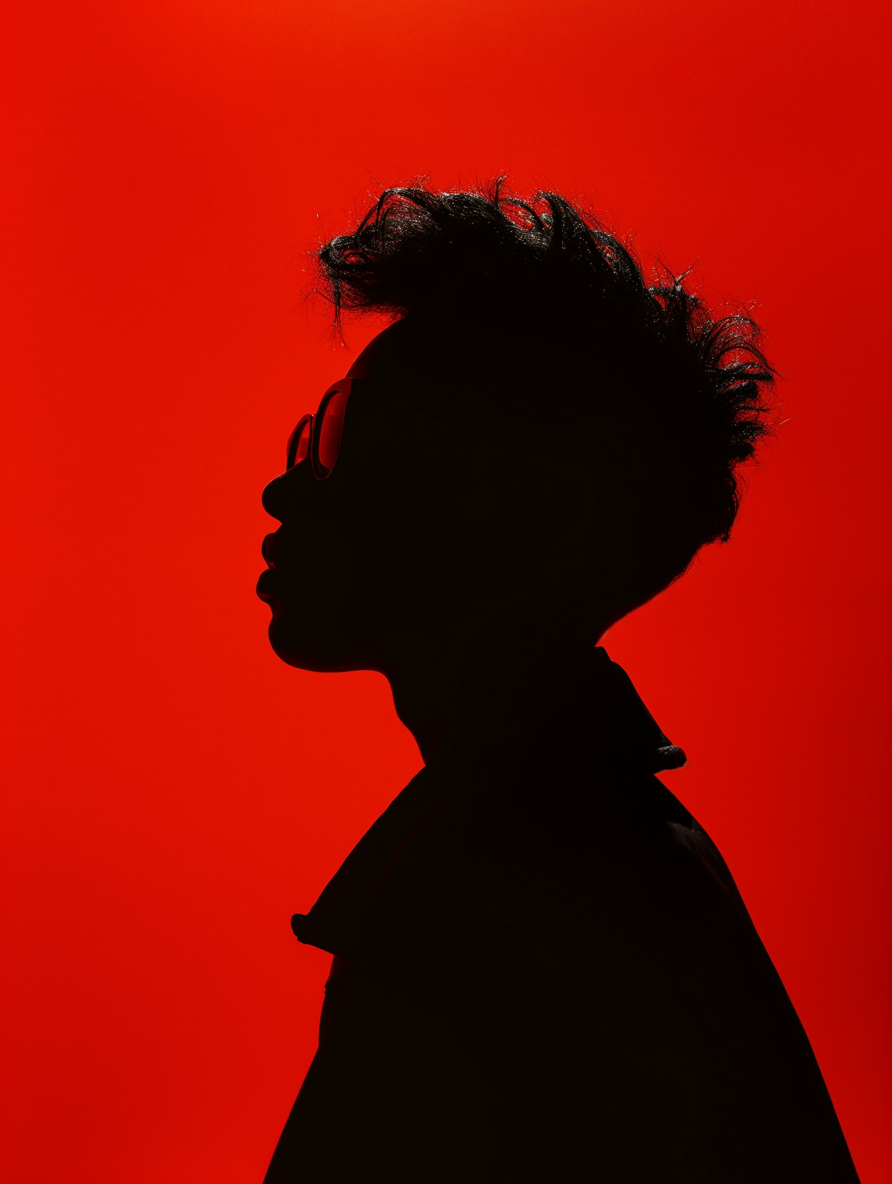 silhouette of a male figure on a red background